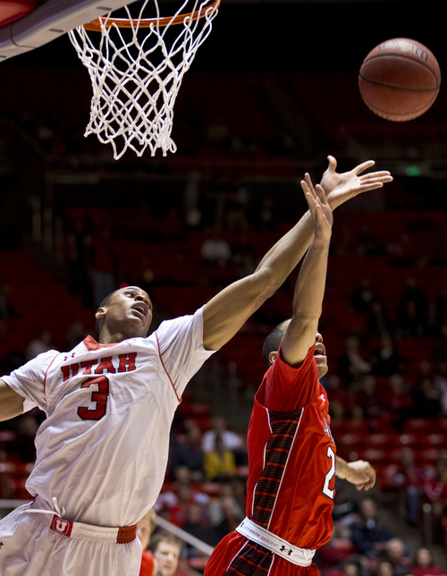 Lennie Mahler  |  The Salt Lake Tribune
Utah's Princeton Onwas attempts to rebound the ball over Lamar's Anthony Holliday in Utah's 84-57 win Friday, Nov. 22, 2013, at the Huntsman Center.