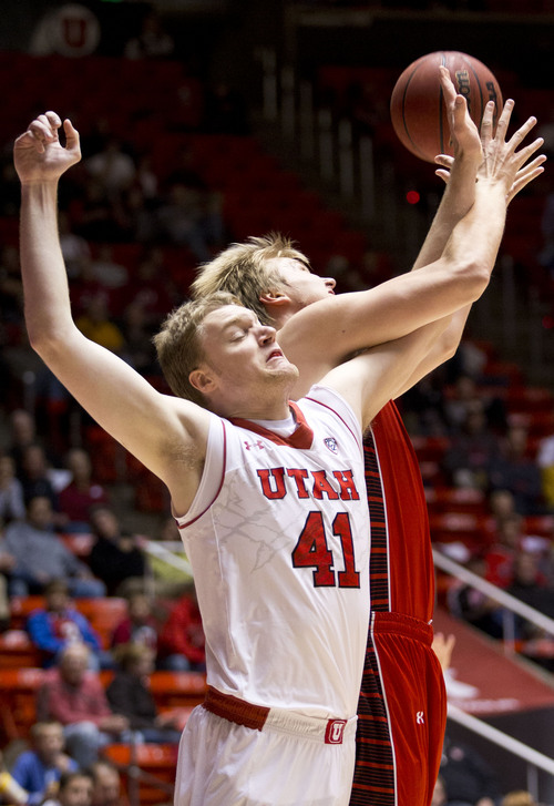 Lennie Mahler  |  The Salt Lake Tribune
Utah's Jeremy Olsen reaches for a rebound over Lamar's Sebastian Norman in Utah's 84-57 win Friday at the Huntsman Center.