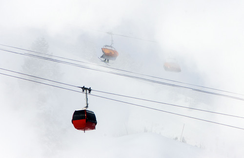 Tribune file photo by Steve Griffin | 
On a frigid morning last January, gondola cars carried warm passengers past clouds of snow from snowmaking guns at Canyons Resort, which will be managed starting this season by Vail Resorts, Inc., part of the Utah skiing industry's move into the big time.

Skiers brave sub-zero temperatures as a gondola passes through clouds of man-made snow at the Canyons Resort in Park City, Utah Monday January 14, 2013.