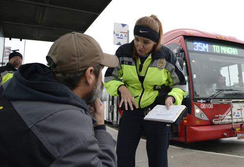Al Hartmann  |  The Salt Lake Tribune
UTA police officer Aymee Race explains the ticket she has just written up to a rider getting off a MAX bus who failed to buy a ticket.