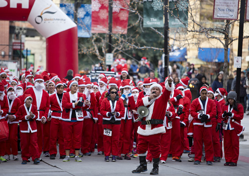 Lennie Mahler  |  The Salt Lake Tribune
A group of about 600 runners dressed as Santa Claus gather in the Gateway Mall for the annual 5K Santa Run on Saturday, Nov. 23, 2013.