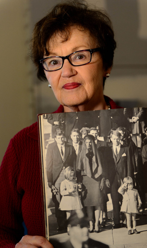 Trent Nelson  |  The Salt Lake Tribune
Rosemary Baron shows the famous Stan Stearns photograph of John F. Kennedy Jr. saluting his father's coffin from a book she collected in the aftermath of the JFK assassination. Baron was a college student at a Catholic university in Ohio in 1963, when the nation's 35th president was assassinated. She still has memorabilia of the event and remembers the details like it was yesterday. While she felt a connection to Kennedy because of his religion, she was more inspired by his idealism, which influenced her own career as an educator. Baron was photographed in Salt Lake City, Tuesday, Nov. 12, 2013.