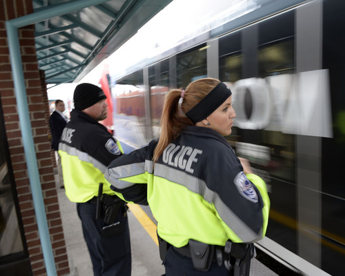 Al Hartmann  |  The Salt Lake Tribune
UTA police officers Steve Rowland and Aymee Race wait at station platform to hop on a TRAX train for a check to see if riders have purchased tickets.