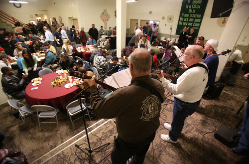 Francisco Kjolseth  |  The Salt Lake Tribune
The Road to Freedom Biker Mission group sings "Keep on the Sunnyside" as the Rescue Mission of Salt Lake serves hundreds of meals and gives away thousands of coats and warm clothes to Utah's homeless and low-income families Tuesday.