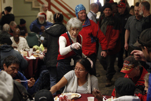 Francisco Kjolseth  |  The Salt Lake Tribune
Homeless advocate Pamela Atkinson helps hand out Thanksgiving meals the Rescue Mission of Salt Lake serves hundreds of meals and gives away thousands of coats and warm clothes to Utah's homeless and low-income families at the annual Day-Before-Thanksgiving Banquet. The Mission also supplied haircuts, flu shots, hot showers and hygiene items along with live music and addiction counseling for the Mission's Thanksgiving guests.