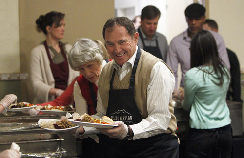Francisco Kjolseth  |  The Salt Lake Tribune
Gov. Gary R. Herbert joins homeless advocate Pamela Atkinson at the Rescue Mission of Salt Lake to serve up hundreds of meals and give away thousands of coats and warm clothes to Utah's homeless and low-income families at the annual Day-Before-Thanksgiving Banquet. The Mission also supplied haircuts, flu shots, hot showers and hygiene items, along with live music and addiction counseling for the Mission's Thanksgiving guests.