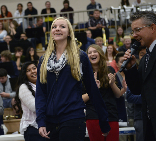 Al Hartmann  |  The Salt Lake Tribune
The Hunter High School student body cheers as junior Kaylee Duke wins a 2001 Honda Accord Tuesday, Nov. 26, 2013, for perfect attendance. She was the grand prize winner among a group of students with perfect attendancewho spun a wheel for prizes in an assembly at the school. Other students with perfect attendance won gift certificates, an iPad Mini and other prizes.