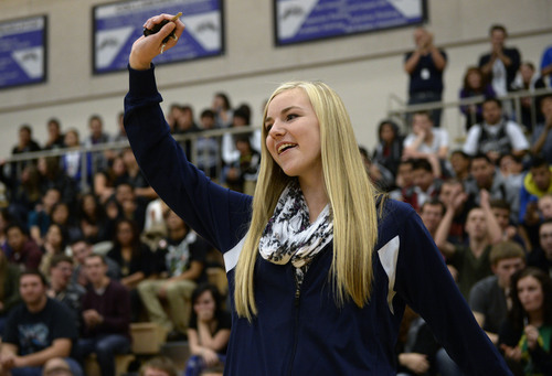 Al Hartmann  |  The Salt Lake Tribune
Hunter High School junior Kaylee Duke waves a set of car keys in celebration upon winning a 2001 Honda Accord Tuesday, Nov. 26, 2013, for perfect attendance. She was the grand prize winner among a group of students with perfect attendance who spun a wheel for prizes in an assembly. Other students with perfect attendance won gift certificates, an iPad Mini and other prizes.