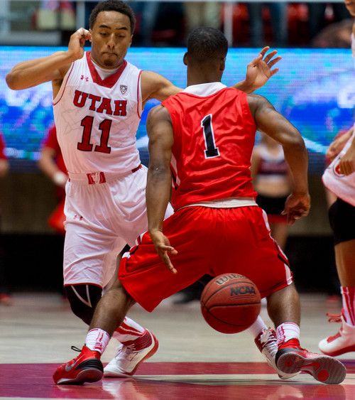 Trent Nelson  |  The Salt Lake Tribune
Ball State's Zavier Turner (1) temporarily loses possession of the ball, defended by Utah's Brandon Taylor (11), as the University of Utah hosts Ball State, NCAA basketball Wednesday November 27, 2013 at the Huntsman Center in Salt Lake City.