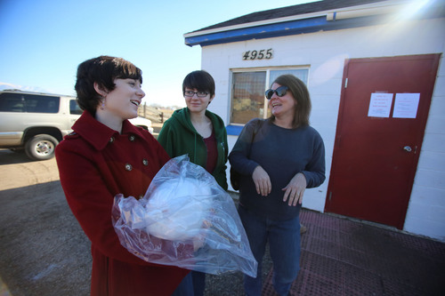Francisco Kjolseth  |  The Salt Lake Tribune
Brenna Bellah, 18, left, joins her sister Stephanie, 17, and mother Terri of Kaysville to pick up their 20-pound turkey at Wight's Poultry Farm in Weber County on Monday, Nov. 25, 2013.Third generation turkey farmers Carol and Craig Hess sell some 4,700 fresh turkeys each Thanksgiving, and another 300 to 400 for Christmas.