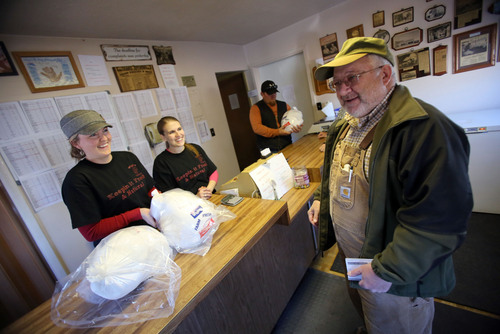 Francisco Kjolseth  |  The Salt Lake Tribune
Sisters Kellie Graham, left, and Kristina Mack along with their cousin Dustin Hess, in background, joke around with retired obstetrician Steve Johnson of South Ogden. The retired obstetrician, who delivered the three as infants,  buys two turkeys every year from Wight's Poultry Farm, founded by their grandfather in western Weber County.