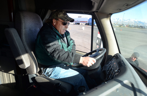 Steve Griffin  |  The Salt Lake Tribune

Todd Dameron, a backing instructor for C.R. England Trucking, left, works with lead backing instructor, Mike Bemis, lower right, as they practice a straight line back up at C.R. England's driving course in Salt Lake City Monday, Nov. 18, 2013. The company is looking to hire 3,500 military veterans this year as drivers. Dameron is a Marine veteran who served from 1983-1990 and Bemis is an Army veteran who served from 2003-2009.