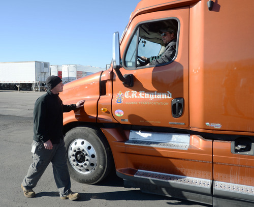 Steve Griffin  |  The Salt Lake Tribune

Todd Dameron, a backing instructor for C.R. England Trucking, right, works with lead backing instructor, Mike Bemis, as they practice a straight line back up at C.R. England's driving course in Salt Lake City Monday, Nov. 18, 2013. The company is looking to hire 3,500 military veterans this year as drivers. Dameron is a Marine veteran who served from 1983-1990 and Bemis is an Army veteran who served from 2003-2009.