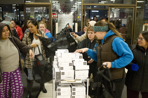 Jeremy Harmon  |  The Salt Lake Tribune

Shoppers crowd through the doors at JC Penney Valley Fair Mall location in West Valley as the store opens on Thanksgiving Day, Thursday, November 28, 2013.
