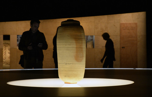 Al Hartmann  |  The Salt Lake Tribune
People look at individual pieces or writings in the Scroll Gallery at the Dead Sea Scrolls exhibit at The Leonardo in Salt Lake City.  The lidded jar in center is from one of the original caves where the scrolls were found.