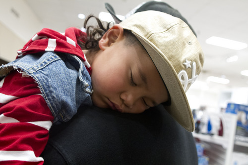 Jeremy Harmon  |  The Salt Lake Tribune

Four-year-old Sa'a Talanoa sleeps on the shoulder of his father Bernard Talanoa as the family shops at JC Penney Valley Fair Mall location in West Valley as the store opens on Thanksgiving Day, Thursday, November 28, 2013.