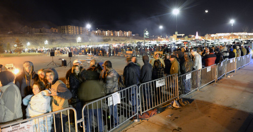 Al Hartmann  |  The Salt Lake Tribune
People lined up in front of Cabela's in Lehi Friday November 29 to enter the store at 5 a.m. when the doors open. The store estimated about 4,000 folks lined up in a line that stretched around three sides of the building. Many received prizes for waiting in line.   Those towards the front of the line arrived on Thursday morning and camped out overnight.