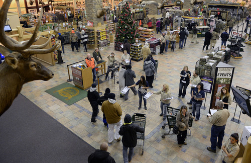 Al Hartmann  |  The Salt Lake Tribune
First shoppers enter Cabela's in Lehi Friday November 29 as the store opened at 5 a.m.  Even though there were thousands  lined up to get in there was no mad rush to get through the doors.  Shoppers entered in a controlled way through one door for a safe experience.