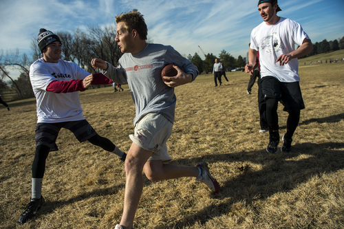 Chris Detrick  |  The Salt Lake Tribune
Kurt Bagley is run out of bounds by Chase Taylor and Nick Taylor during the annual Turkey Bowl football game at Sugar House Park Thursday November 28, 2013. Member of the Crandall, Hansel and Taylor families have been continuing this Thanksgiving Day tradition for over 30 years.