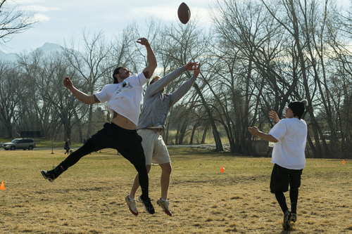 Chris Detrick  |  The Salt Lake Tribune
Nick Taylor, left, breaks up a pass intended for Kurt Bagley during the annual Turkey Bowl football game at Sugar House Park Thursday November 28, 2013. Member of the Crandall, Hansel and Taylor families have been continuing this Thanksgiving Day tradition for over 30 years.