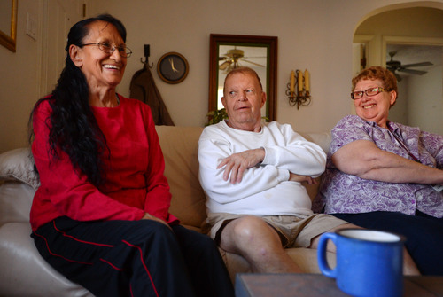 Steve Griffin  |  The Salt Lake Tribune
Senior companions Rose Martinez, left, and Colleen Johnson laugh with Paul Murray during a visit to his Magna, Utah home last week. The women visit Murray helping him with household chores and errands during the week.
