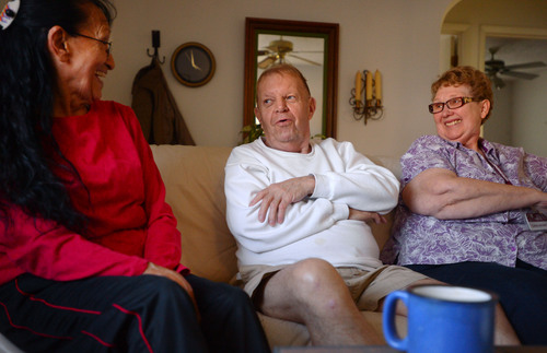 Steve Griffin  |  The Salt Lake Tribune

Senior companions Rose Martinez, left, and Colleen Johnson laugh with Paul Murray during a visit to his Magna, Utah home Monday, November 25, 2013. The women visit Murray helping him with household chores and errands during the week.