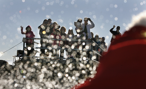 Scott Sommerdorf   |  The Salt Lake Tribune
With water spray kicking up like snow, Santa and the Grinch (Keith Morgan and John Lohner), get waves from the crowd that came to see them water ski for a good cause. The public was invited to watch and bring a canned food item to donate to the Utah Food Bank, as they waterski on Utah Lake, Saturday November 30, 2013.