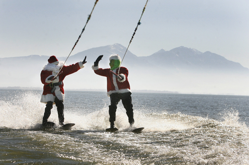 Scott Sommerdorf   |  The Salt Lake Tribune
Santa and the Grinch (Keith Morgan and John Lohner), will be water skiing for a good cause - inviting the public to watch and bring a canned food item to donate to the Utah Food Bank, as they waterski on Utah Lake, Saturday November 30, 2013.