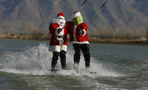 Scott Sommerdorf   |  The Salt Lake Tribune
Santa and the Grinch (Keith Morgan and John Lohner), will be water skiing for a good cause - inviting the public to watch and bring a canned food item to donate to the Utah Food Bank, as they waterski on Utah Lake, Saturday November 30, 2013.