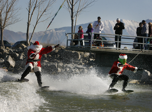 Scott Sommerdorf   |  The Salt Lake Tribune
Santa and the Grinch (Keith Morgan and John Lohner), will be water skiing for a good cause - inviting the public to watch and bring a canned food item to donate to the Utah Food Bank, as they waterski on Utah Lake, Saturday November 30, 2013.