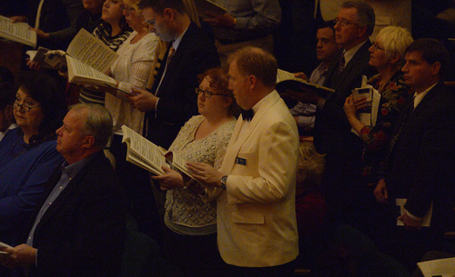 Rick Egan  | The Salt Lake Tribune 

Singers from the Mormon Tabernacle Choir (in white jackets and blue dresses) were strategically placed in the audience to help them sing, during the Utah Symphony's annual "Messiah" Sing-In at Abravanel Hall, Saturday, November 30, 2013.