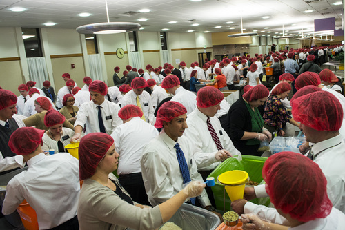 Chris Detrick  |  The Salt Lake Tribune
Mormon missionaries work at preparing meals at the Missionary Training Center in Provo Thursday November 28, 2013.  The 1,800 missionaries spent Thanksgiving by preparing 350,000 meals for hungry Utah children. The packages of nutritious, nonperishable food will be provided to Utah schools where they are sent home with children in need.