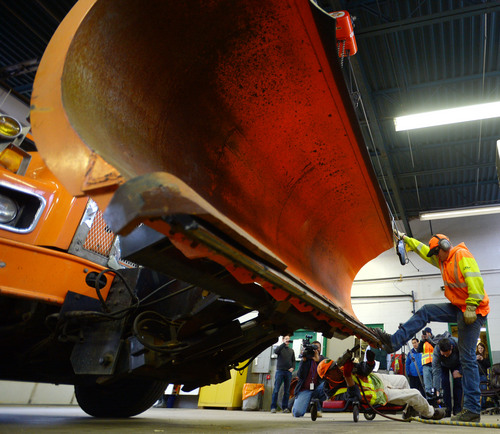 Steve Griffin  |  The Salt Lake Tribune

UDOT maintenance workers change a bent blade on a snowplow as crews get ready for the coming winter storm at the UDOT maintenance yard in Salt Lake City Monday, December 2, 2013.