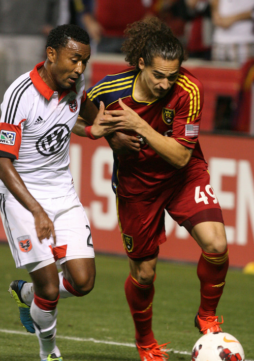 Leah Hogsten | The Salt Lake Tribune
Real Salt Lake forward Devon Sandoval (49) fights D.C. United defender James Riley (2) for possession. Real Salt Lake lost the 2013 U.S. Open Cup Final to D.C. United 1-0 at Rio Tinto Stadium in Sandy, Utah, Tuesday, October 1, 2013. The winner will play in the CONCACAF Champions League.
