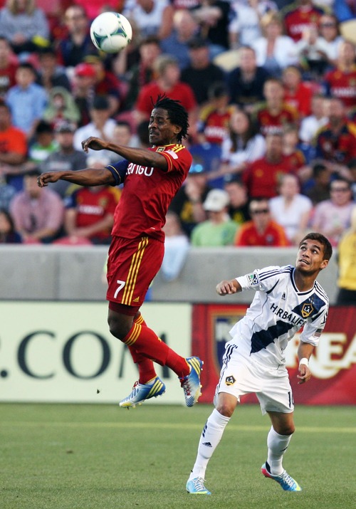 Kim Raff  |  The Salt Lake Tribune
(left) Real Salt Lake defender Lovel Palmer (7) heads the ball over the head of (right) Los Angeles Galaxy midfielder Hector Jimenez (16) during the first half at Rio Tinto in Sandy on April 27, 2013. Real Salt Lake lost the game 2-0.