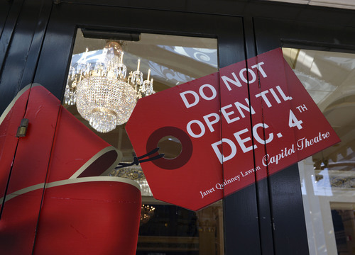 Al Hartmann  |  The Salt Lake Tribune 
After six months of renovation, the Capitol Theatre (now called the Janet Quinney Lawson Capitol Theatre) will be opening for the first Nutcracker performance on Dec. 6.  A sign outside the lobby doors announces the opening.