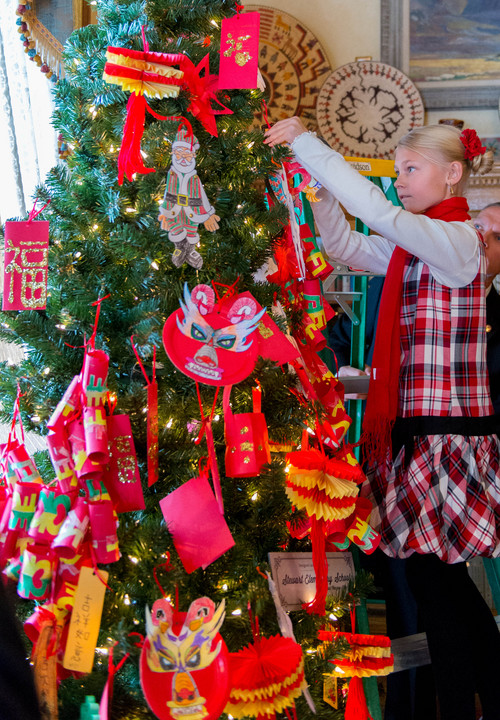 Trent Nelson  |  The Salt Lake Tribune
Emily Bailey was among the students from the Chinese immersion program at Stewart Elementary decorated a Christmas tree at the governor's mansion in Salt Lake City, Tuesday December 3, 2013.