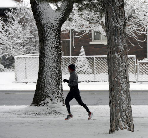 Al Hartmann  |  The Salt Lake Tribune
A runner in Liberty Park is undaunted by the first major winter snowstorm of the season along the Wasatch Front Tuesday December 3.