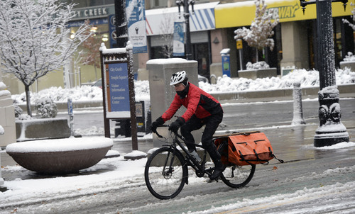 Al Hartmann  |  The Salt Lake Tribune
A bicyclist along Main Street in Salt Lake City rides prepared in the first major winter snowstorm of the season along the Wasatch Front Tuesday December 3.