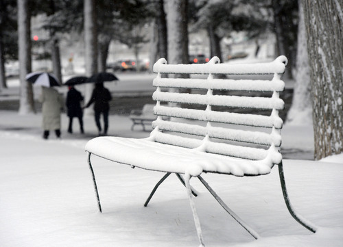 Al Hartmann  |  The Salt Lake Tribune
There is "snow on the benches" along with snow across most of Utah this week. Bundled up walkers in Liberty Park take in the first major winter snowstorm of the season along the Wasatch Front Tuesday December 3.