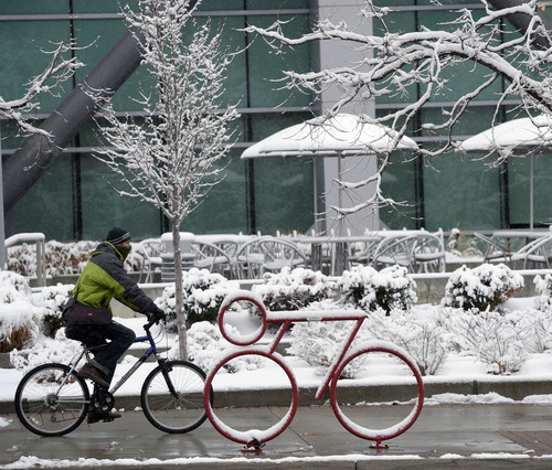 Al Hartmann  |  The Salt Lake Tribune
Bundled up bicyclist rides through a snowy scene along State Street during the first major winter snowstorm of the season along the Wasatch Front Tuesday December 3.