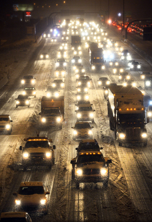 Steve Griffin  |  The Salt Lake Tribune


Traffic creeps along snow and ice covered I-15 near 5600 south in Salt Lake City, Utah Tuesday, December 3, 2013.
