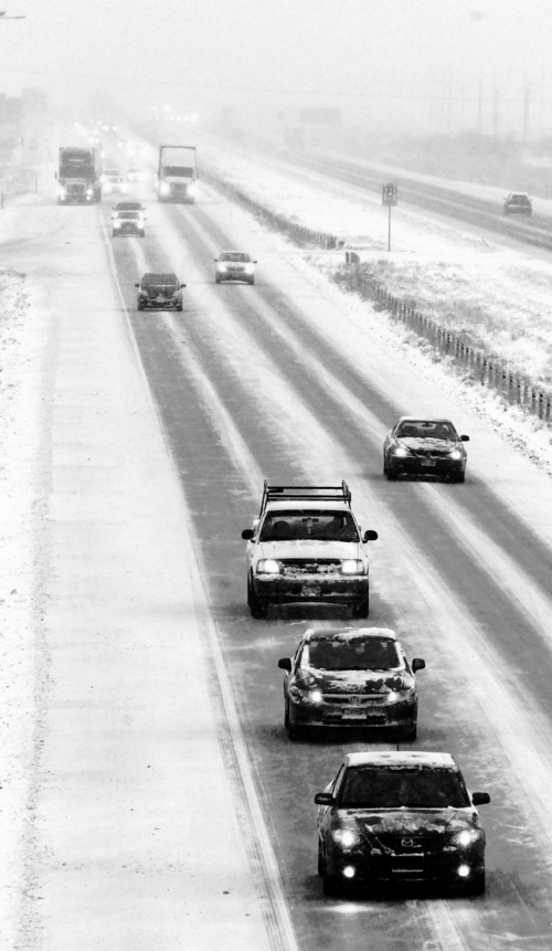 Leah Hogsten  |  The Salt Lake Tribune
The drive along I-80 near Saltair Tuesday afternoon was slow but steady. The snow storm has wreaked havoc on commuters and traffic with reportedly more than 50 accidents, December 3, 2013.