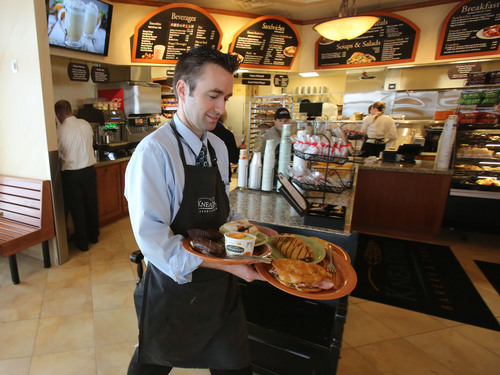 Francisco Kjolseth  |  The Salt Lake Tribune
Joel Orton serves up fresh breakfast fare at Kneaders Bakery, celebrating its 16th anniversary this week with the opening of a brand new store in Orem. The new store replaces the company's first and original location that had gotten too small. Kneaders now has 25 stores in four states with more expansion plans in the works.