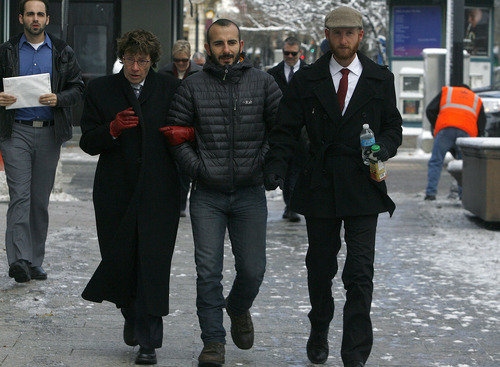 Scott Sommerdorf   |  The Salt Lake Tribune
Moudi Sbeity, center, and Derek Kitchen, right, arrive with their attorney Peggy A. Tomsic at U.S. District Court Wednesday morning, Dec. 4, 2013, to appear before Judge Robert J. Shelby who will hear arguments in the lawsuit brought by three couples who argue Utah's ban on same-sex marriage is unconstitutional. The woman at left is unidentified.