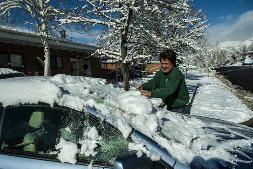 Chris Detrick  |  The Salt Lake Tribune
Bill Brown uses a broom to clean off snow on his car in Salt Lake City Wednesday Dec. 4, 2013.