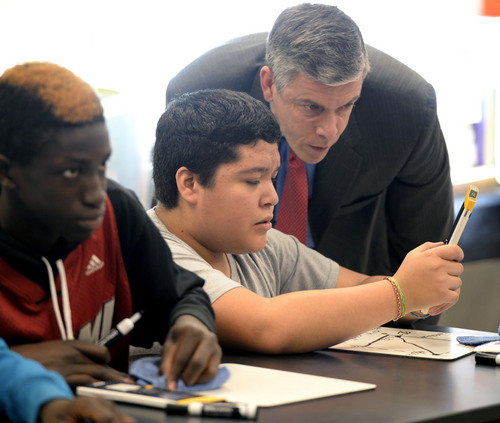 Al Hartmann  |  The Salt Lake Tribune
Francisco Gomez shows Education Secretary Arne Duncan how to work through a problem with an Npire calculator in Roger Haglund's 8th grade math class at Northwest Middle School in Salt Lake City Thursday Dec. 5, 2013. In 2010 the school got a $2.3 million federal School Improvement Grant.  Such grants target Title I schools with high populations of impoverished students. This school has shown dramatic improvement in academic performance over the three years.