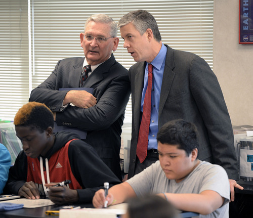 Al Hartmann  |  The Salt Lake Tribune
Utah State Superintendent of Schools Martel Menlove, left,  and Secretary of Education Arne Duncan observe students work through a problem in Roger Haglund's 8th grade math class at Northwest Middle School in Salt Lake City Thursday Dec. 5, 2013. In 2010 the school got a $2.3 million federal School Improvement Grant.  Such grants target Title I schools with high populations of impoverished students. This school has shown dramatic improvement in academic performance over the three years.