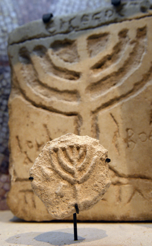 Al Hartmann  |  The Salt Lake Tribune
Plaster Menorah, Caesarea, Byzantine (325-638 CE) on display in the Scroll Gallery at the Dead Sea Scrolls exhibit at The Leonardo in Salt Lake City.