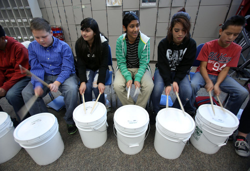 Francisco Kjolseth  |  The Salt Lake Tribune
Northwest Middle School students doing an arts rotation get to do something a little different in music class as they drum on buckets in Cyndy Carlton's class. The Salt Lake City school has had three years of academic growth and on Thursday will host U.S. Secretary of Education Arne Duncan. The school gives teachers performance pay based on student achievement and growth and has created a culture where it's cool to be smart.